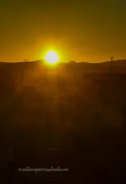 theearlymorningraysofthesuncaressthedesertlandscape.jpg